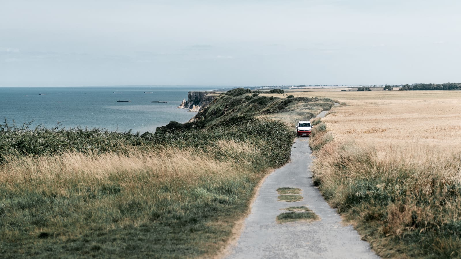 Follow the Coast van parked by the sea with a bike on the rack